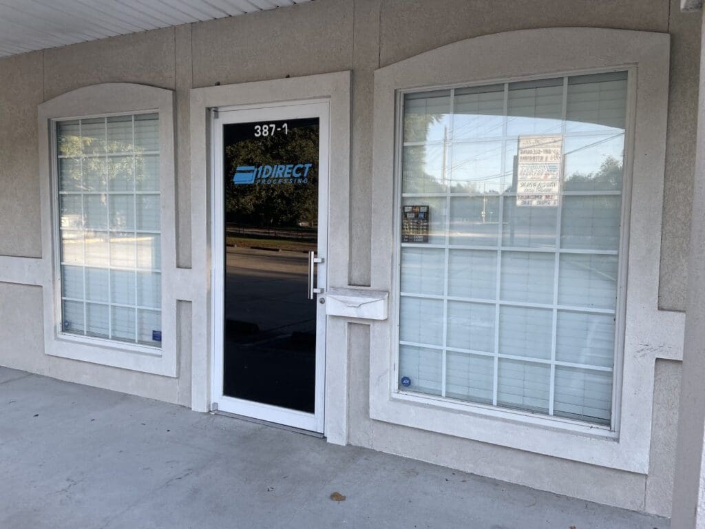 A building with two windows and a door.